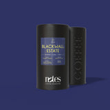 Two black cylindrical containers filled with 100% home compostable, Nespresso® compatible coffee pods with 'Blackwall Estate' label on a purple background.